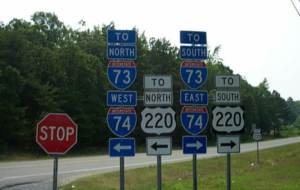 Photo of I-73/I-74 signage on road from NC Zoo, from June 2002