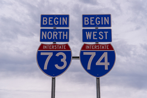 Closeup photo of Begin I-73/I-74 signs placed in 2013 
    just south of Ellerbe, from Mark Clifton