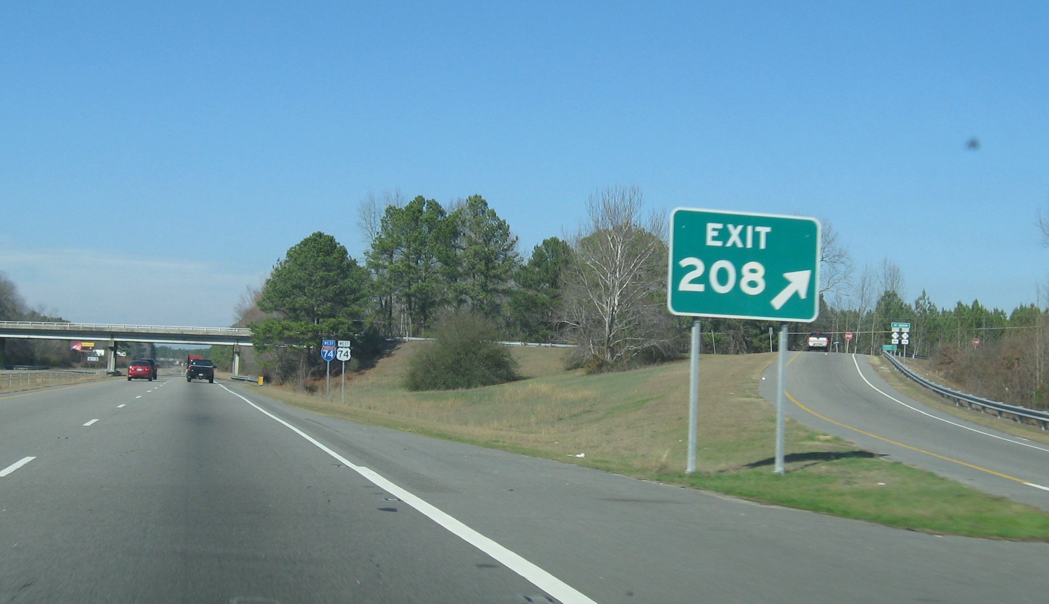 Photo of exit signs and Interstate 74/US 74 shields at then Exit 208 of the 
Laurinburg Bypass in Dec. 2007