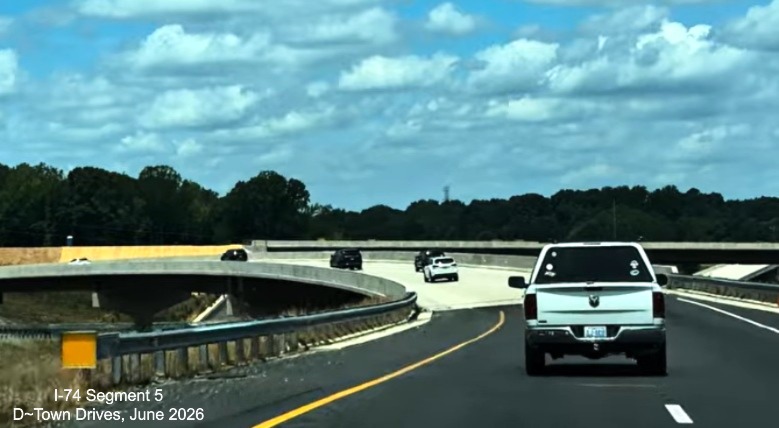 Image of traffic on the future NC 192 exit ramp over the I-74 Winston-Salem
Northern Beltway with nearly completed roadbed below, D~Town Drives, June 2026