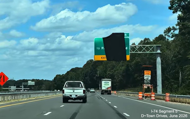 Image of 1/2 Mile advance overhead sign for the future NC 192 exit at the Beltway
interchange covered over, D~Town Drives, June 2026