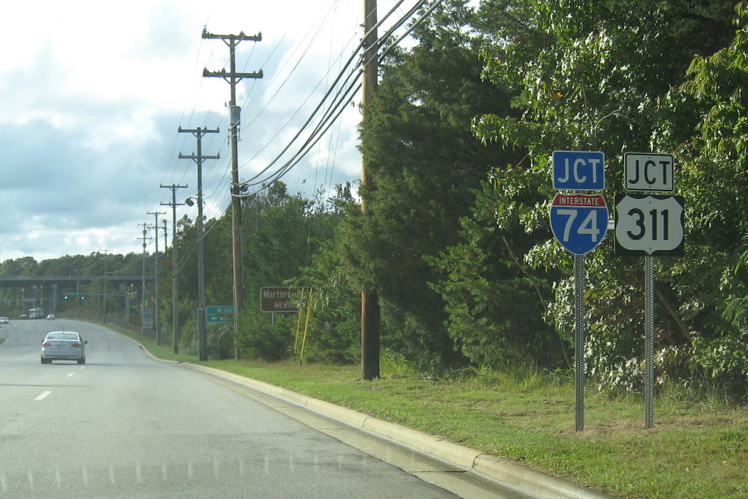 Photo of new I-74/US 311 signage in place at Kivett Drive after final 
section of East Belt highway was completed, Oct. 2011