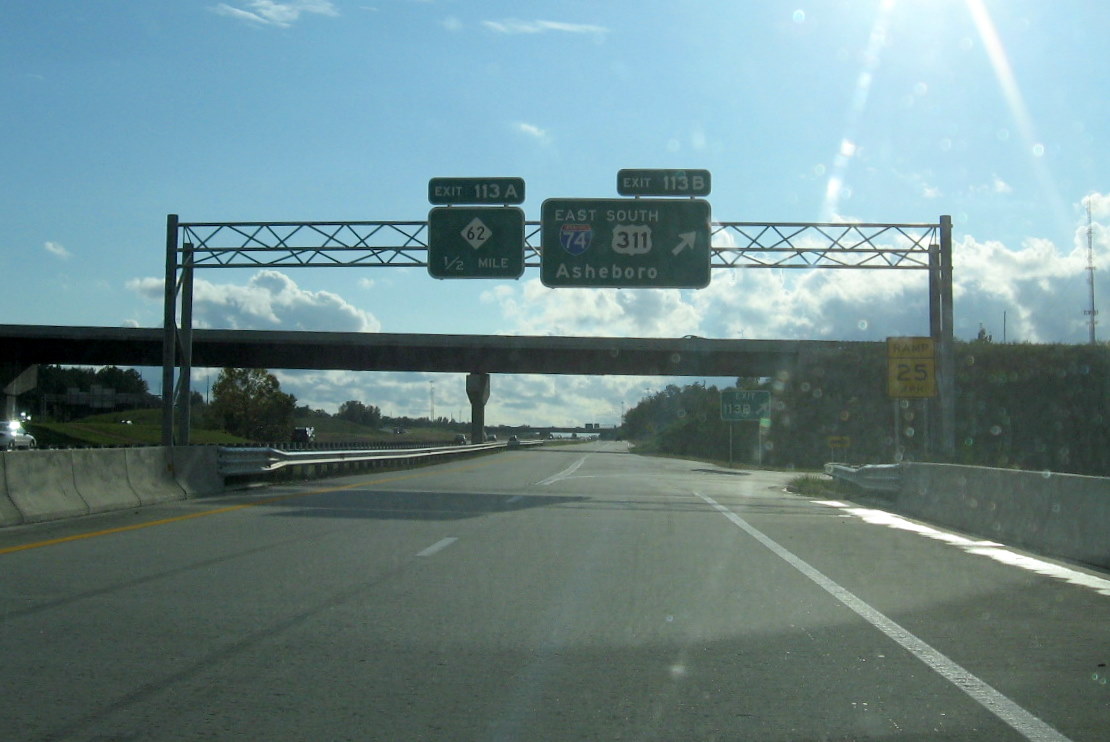 Photo of I-85 exit signage on I-74 West near interchange bridges and ramps, 
Oct. 2011