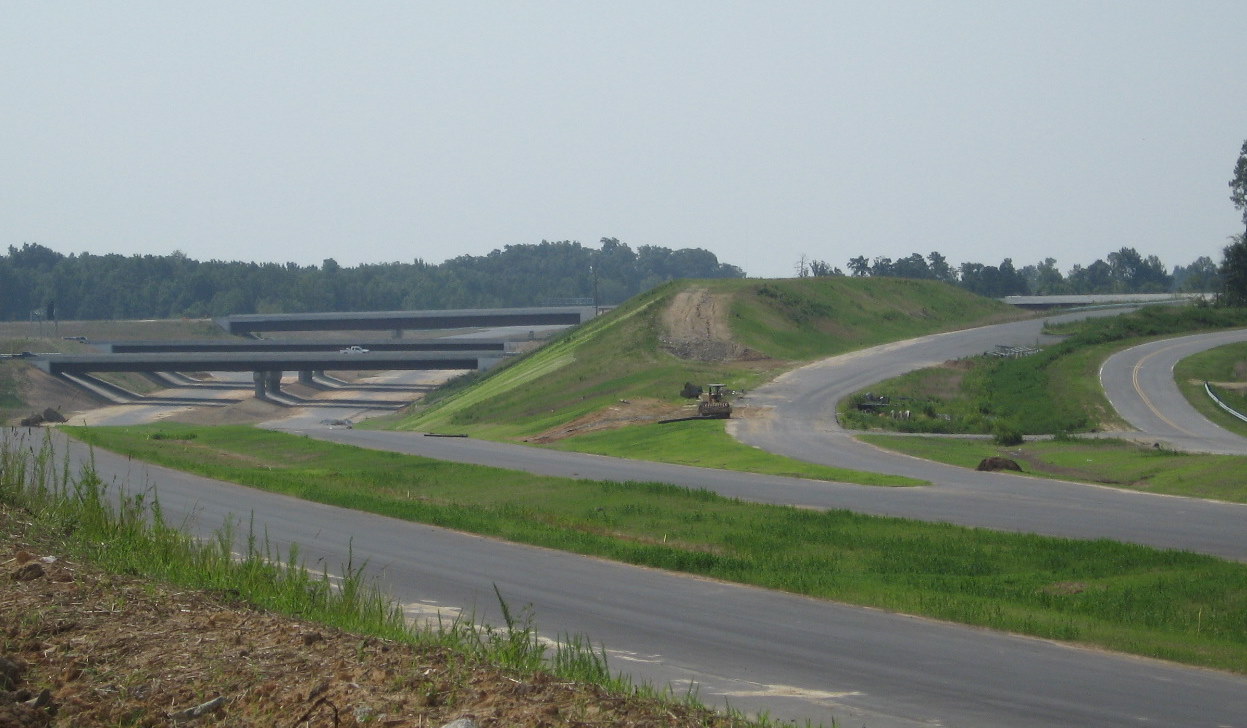 Photo of signs put up along I-74 but covered over months prior to the 
opening of the freeway in July 2010