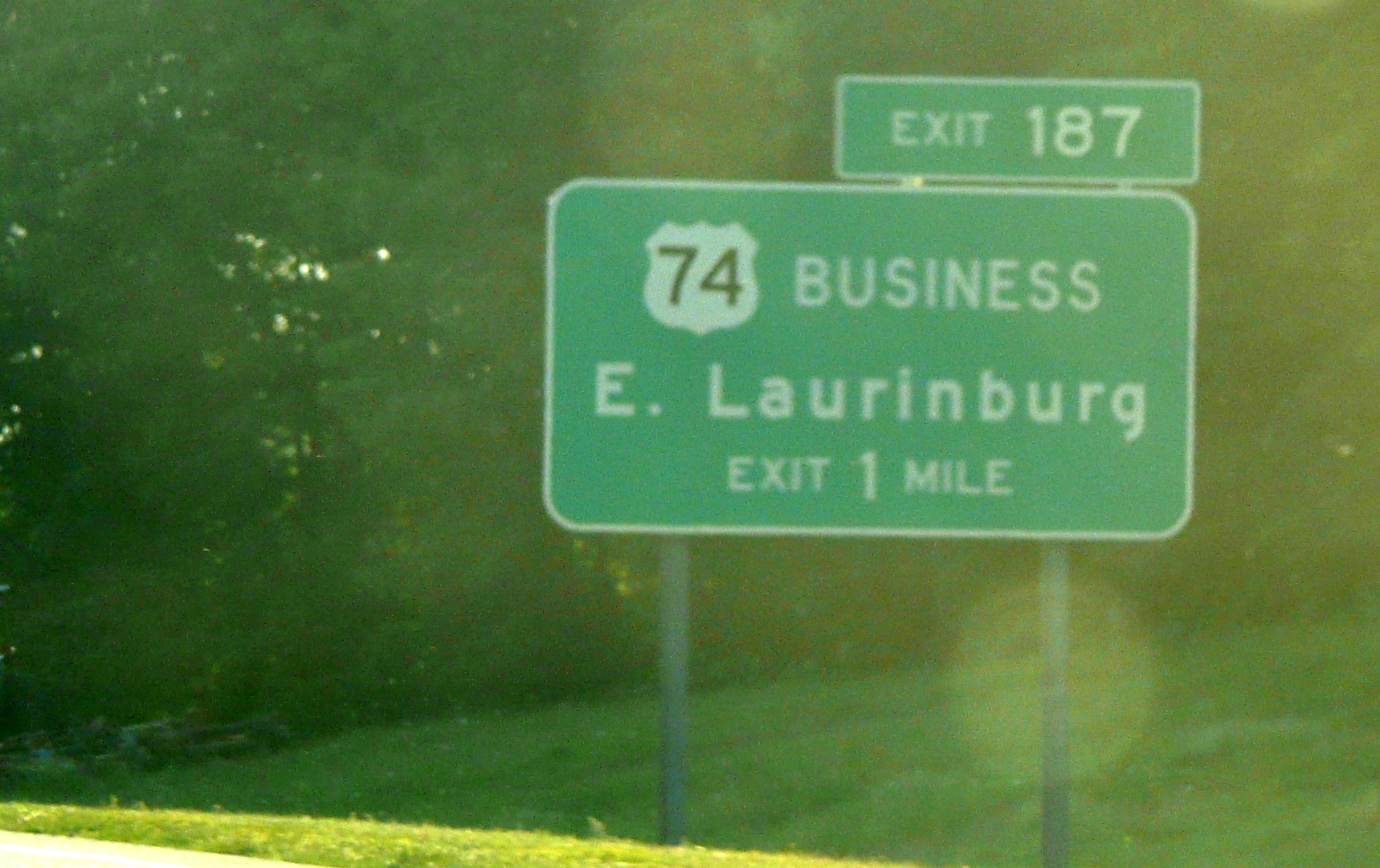 Photo of exit signage for US 74 Business exit on the 
Laurinburg Bypass, May 2009. Courtesy of James Mast