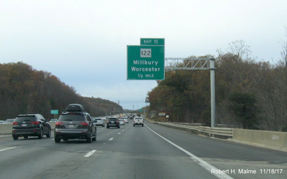 Image of newly placed 1/2 mile advance overhead sign for MA 122 exit on I-90 West in Millbury