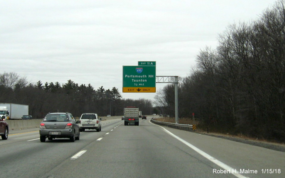 Image of newly placed 1/2 mile advance overhead sign, with yellow exit only tab, for I-495 exit on I-90/Mass Pike East in Westborough