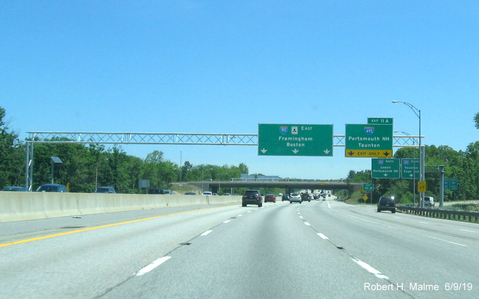 Image of newly placed overhead signs at ramp to I-495 on I-90/Mass Pike East in Hopkinton in June 2019