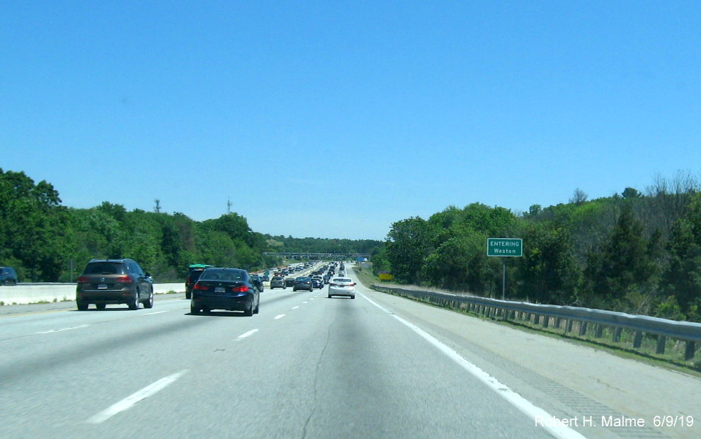 Image of recently placed ground mounted jurisdictional boundary sign for Weston on I-90/Mass Pike East in June 2019