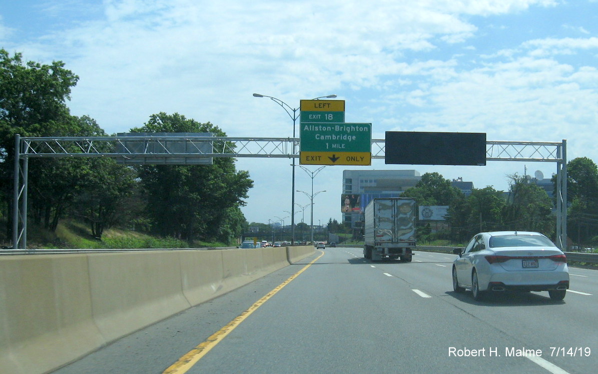 Image of newly placed 1-mile advance sign for Allston-Brighton/Cambridge exit paired with VMS display on I-90/Mass Pike East in Boston