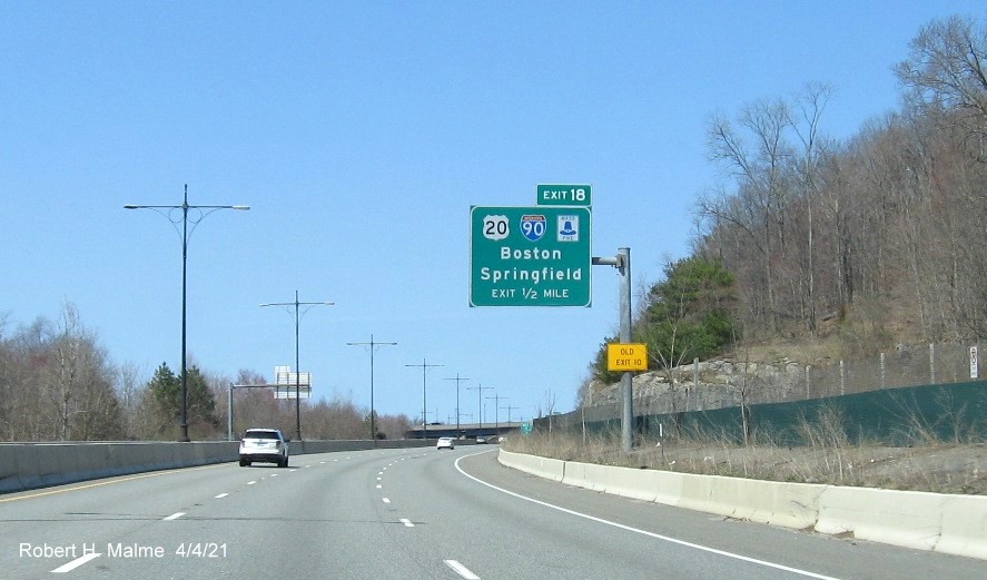 Image of 1/2 mile advance overhead sign for I-90/Mass Pike exit with new milepost based exit number on MA 146 North in Millbury, April 2021