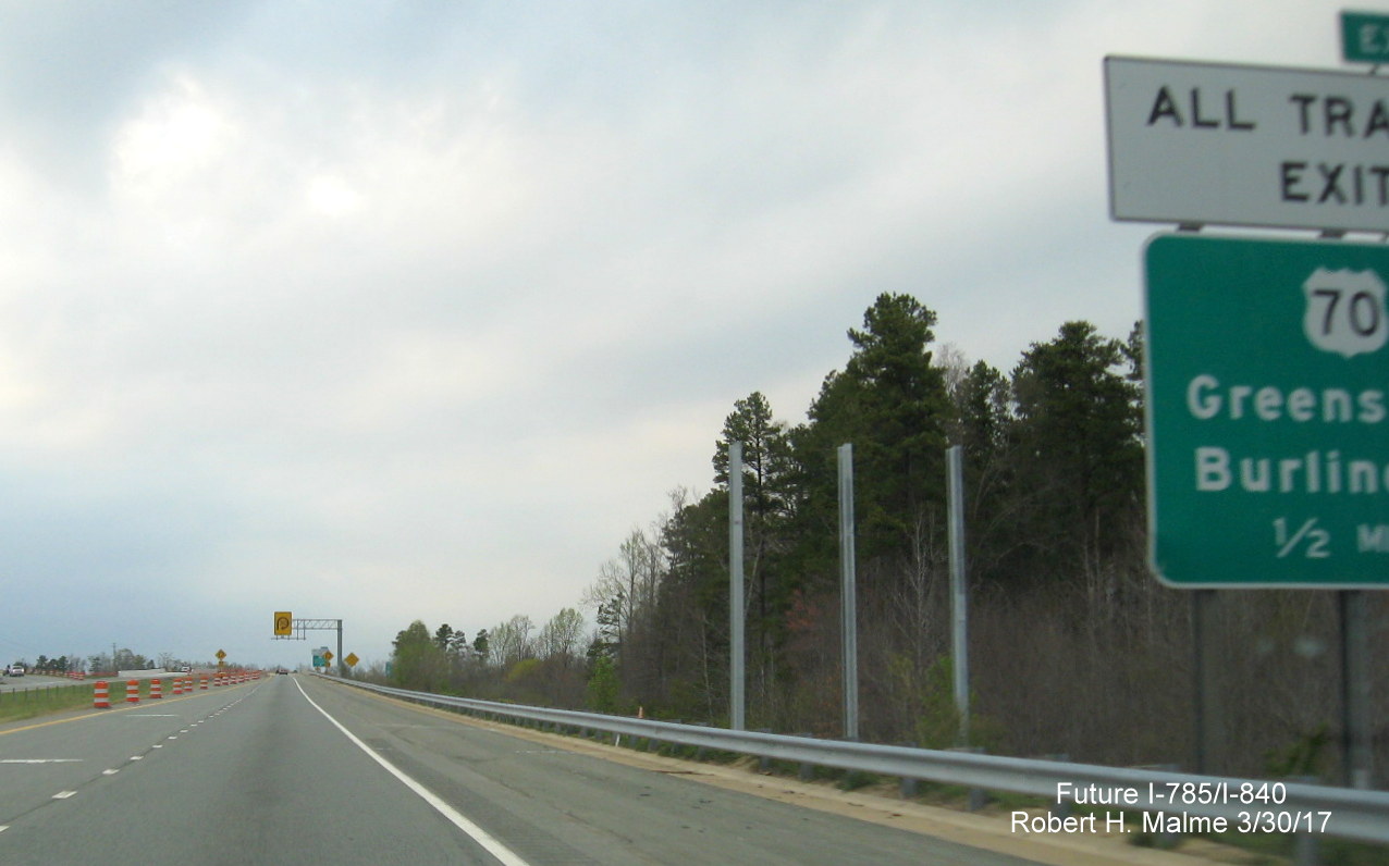 Image taken of exit sign support posts placed prior to US 70 exit on eastern segment of Greensboro Loop