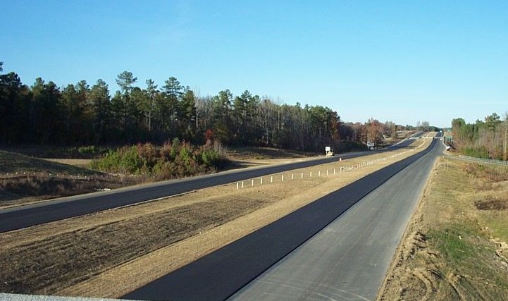 Photo showing new road extending east from intersection of NC 73 and
US 220 near Ellerbe