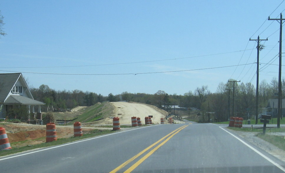 Photo of view of NC 62 bridge from East NC 62, awaiting final grading and road 
realignment in April 2009