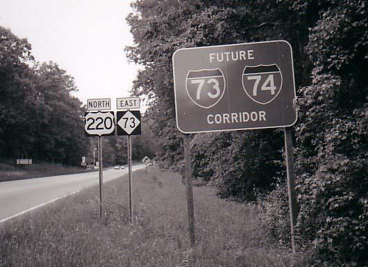 Photo (B&W) of I-74/I-74 Corridor sign placed on US 220/NC 73 north of 
Ellerbe, 2007, courtesy of Adam Prince