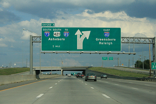 Photo of revised exit signs for I-73 Greensboro Loop on I-40 East. Courtesy of
Evan Semones