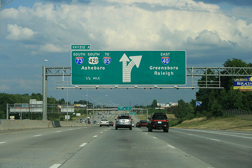 Photo of revised exit signs for I-73 Greensboro Loop on I-40 East. Courtesy of
Evan Semones