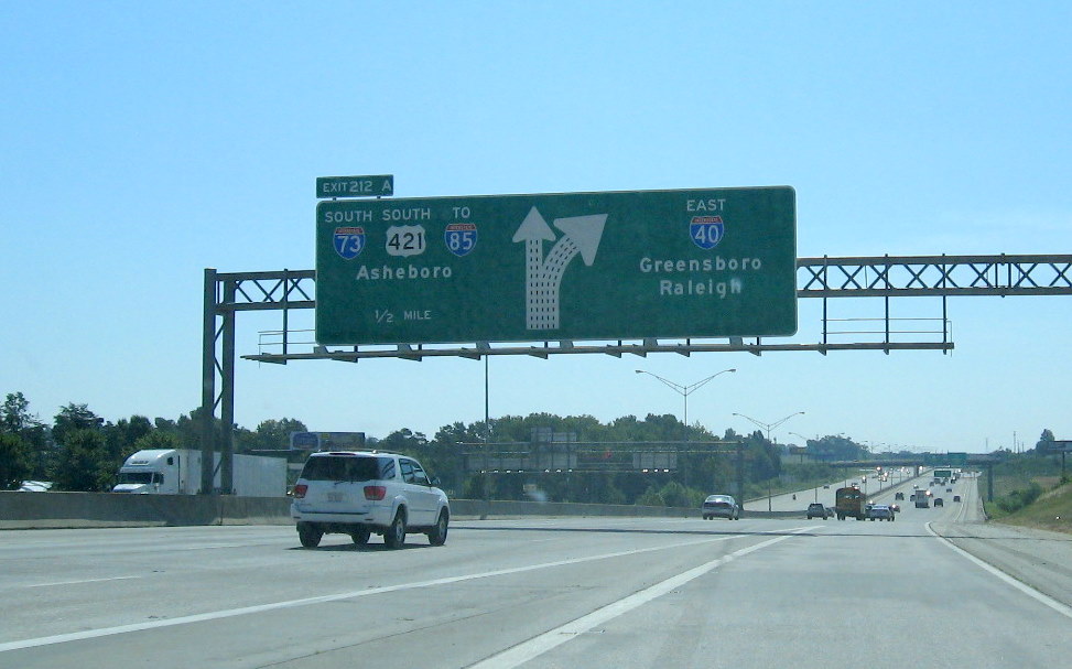 Photo of exit signage approaching Exit 211 on I-40 East in Sept. 2009