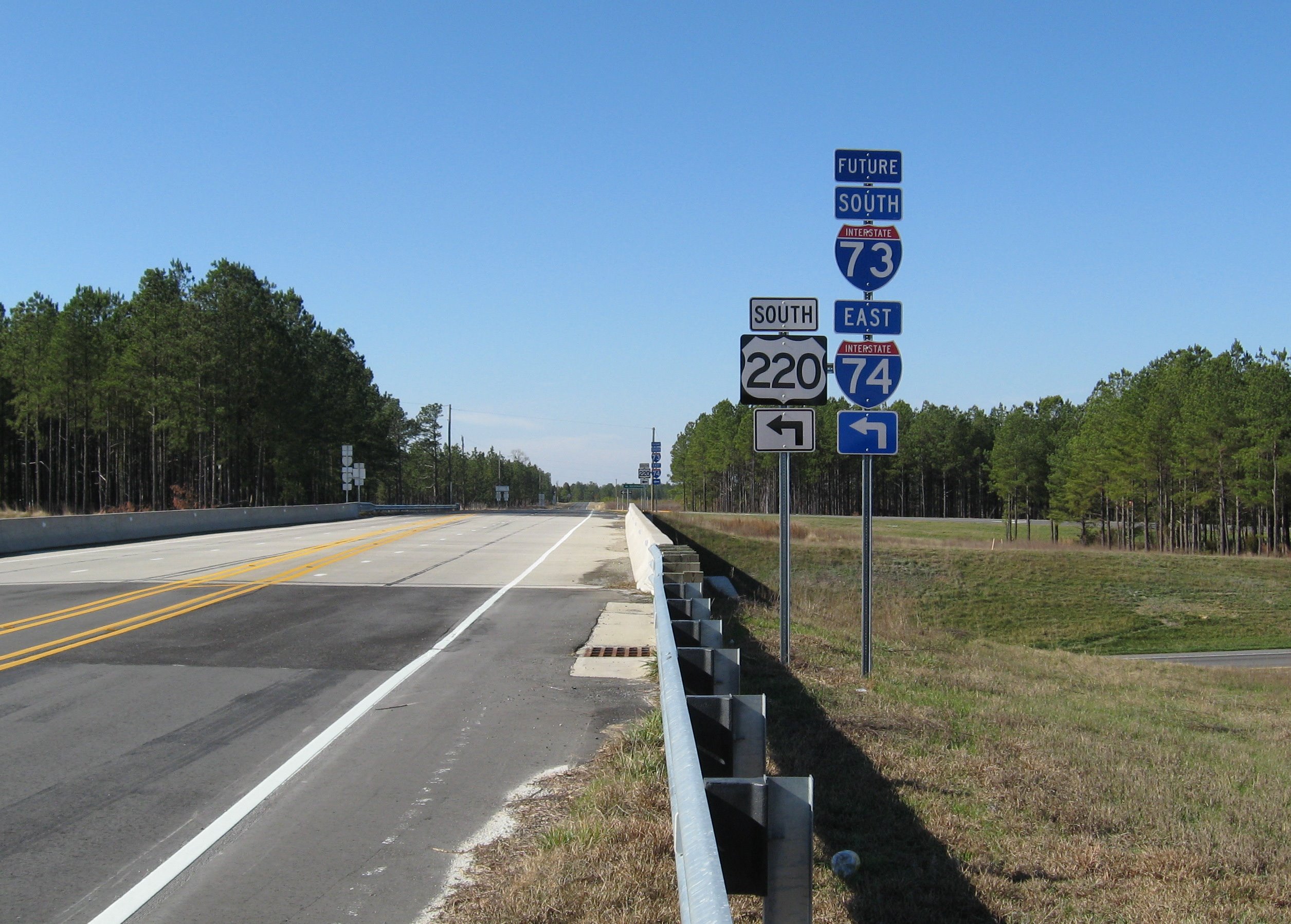 Photo of Tabernacle Church Rd interchange for Future I-73/I-74 showing 
signposts with signs, Jan. 2008