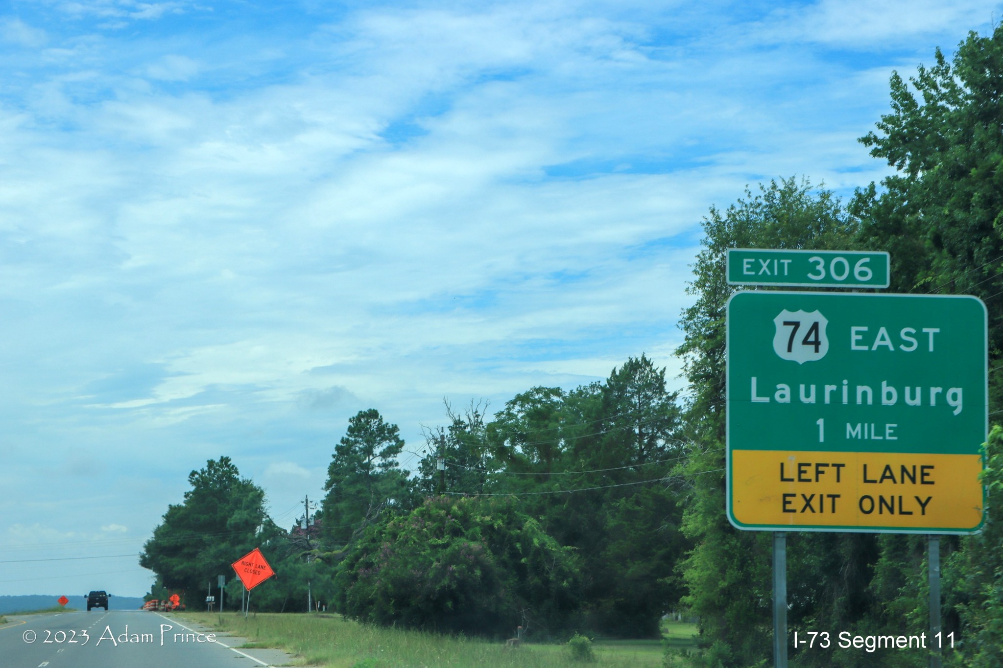 Image of 1 Mile advance sign for US 74 East exit on Business 74 West prior to I-73/I-74 Rockingham
        Bypass construction zone, Adam Prince July 2023