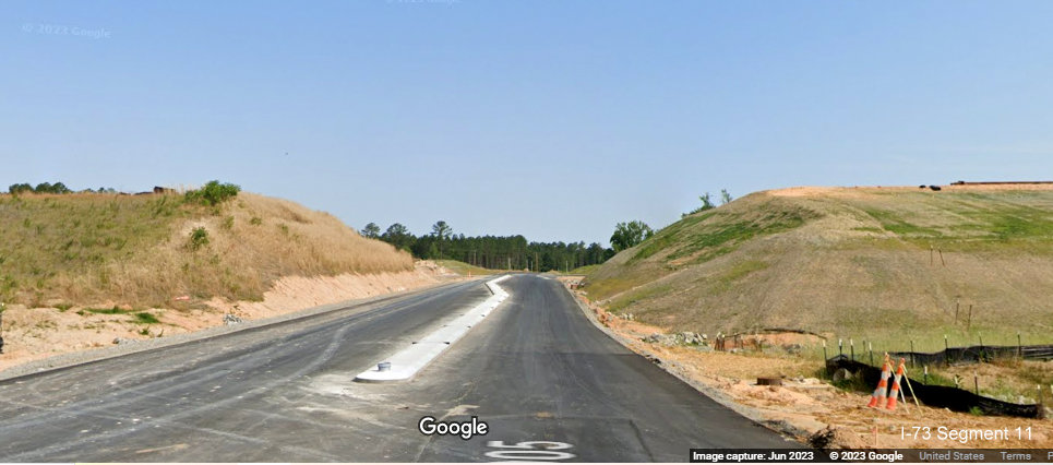 Image of completed landscaping for future bridge carrying I-73/I-74 Rockingham Bypass over Cartledge 
       Creek Road, Google Maps Street View, June 2023