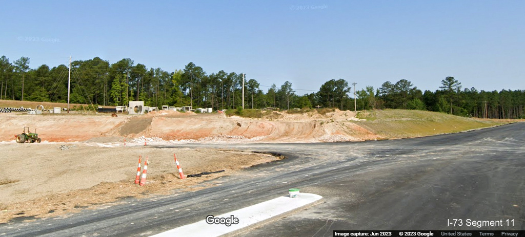 Image of future exit ramp to I-73 North/I-74 West Rockingham Bypass from Cartledge 
       Creek Road, Google Maps Street View, June 2023