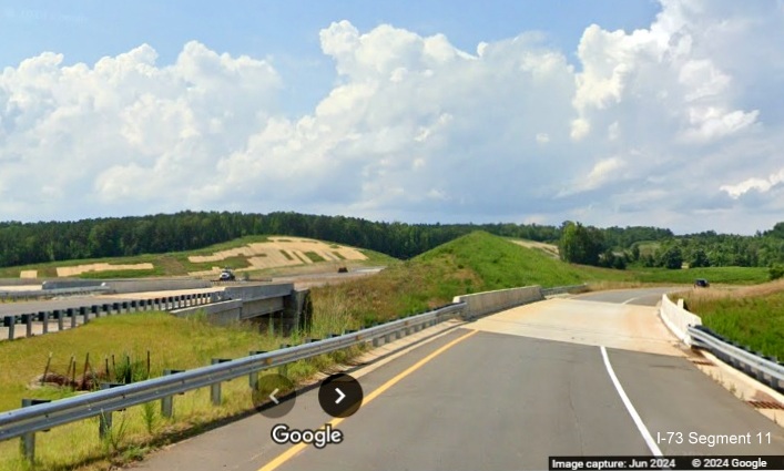 Image of Business 74 ramp from future I-73 North/I-74 West Rockingham Bypass about to  
         cross bridge over US 74 West lanes, Google Maps Street View, June 2024