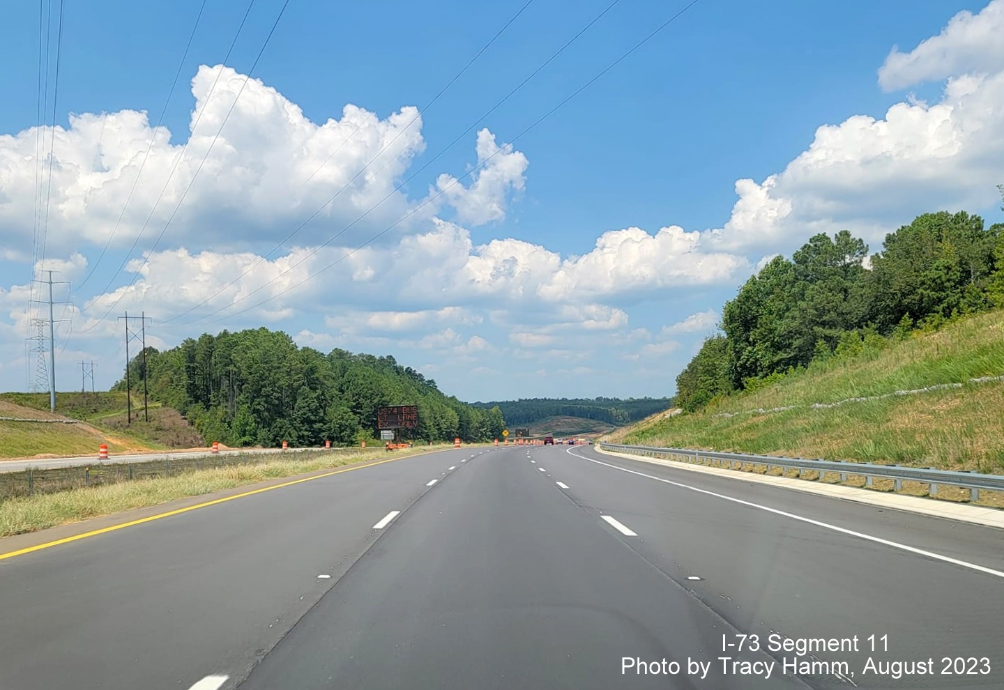 Image of completed 3-lane US 74 West roadway updated to interstate standards prior to future 
        I-73/I-74 Rockingham Bypass interchange, by Tracy Hamm, August 2023