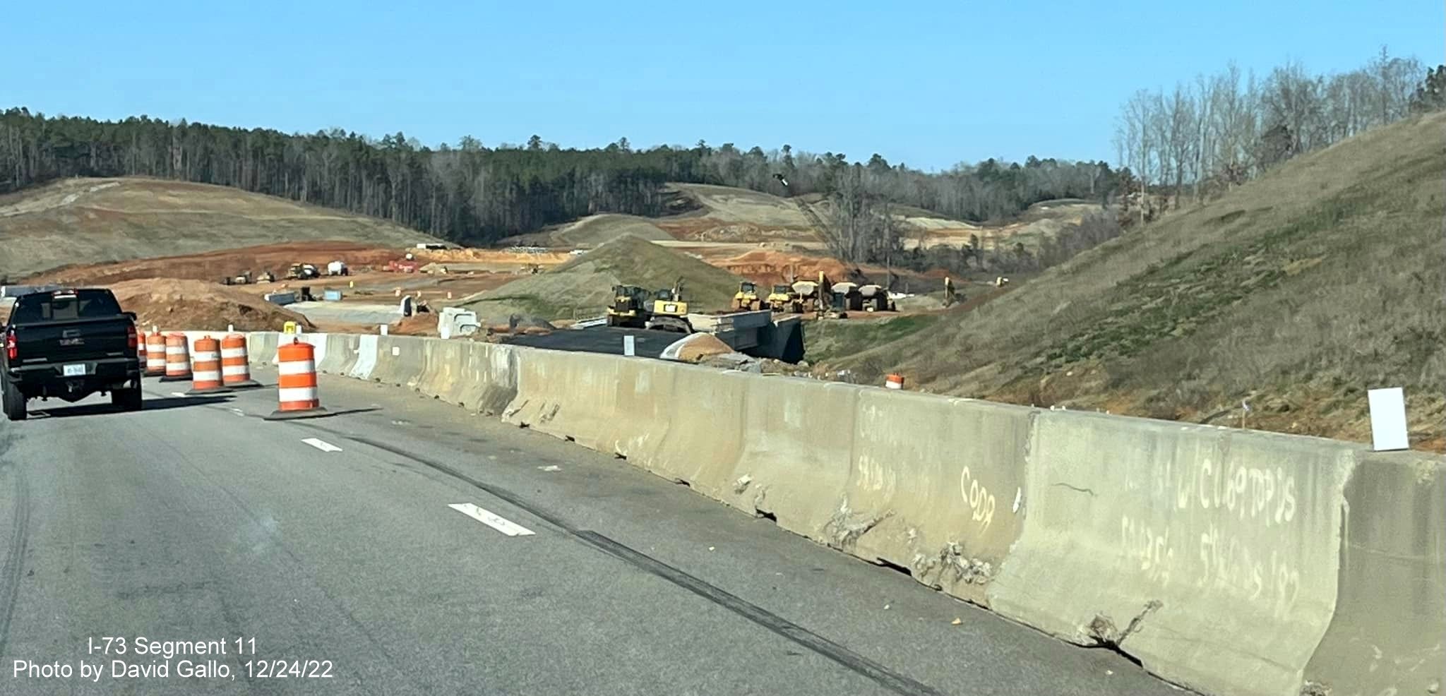 Image of concrete barrier along US 74 West at future I-73/I-74 Rockingham Bypass off-ramp, 
                                            photo by David Gallo, December 2022