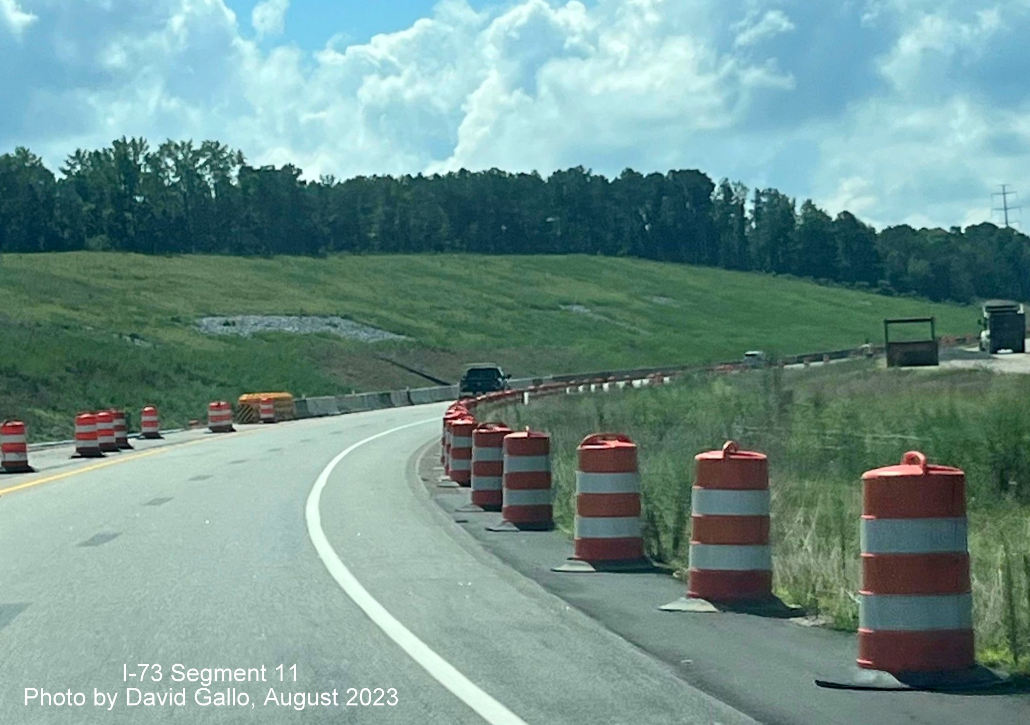 Image of US 74 East traffic using former westbound lanes through remainder of
        Rockingham Bypass construction zone, David Gallo, July 2023