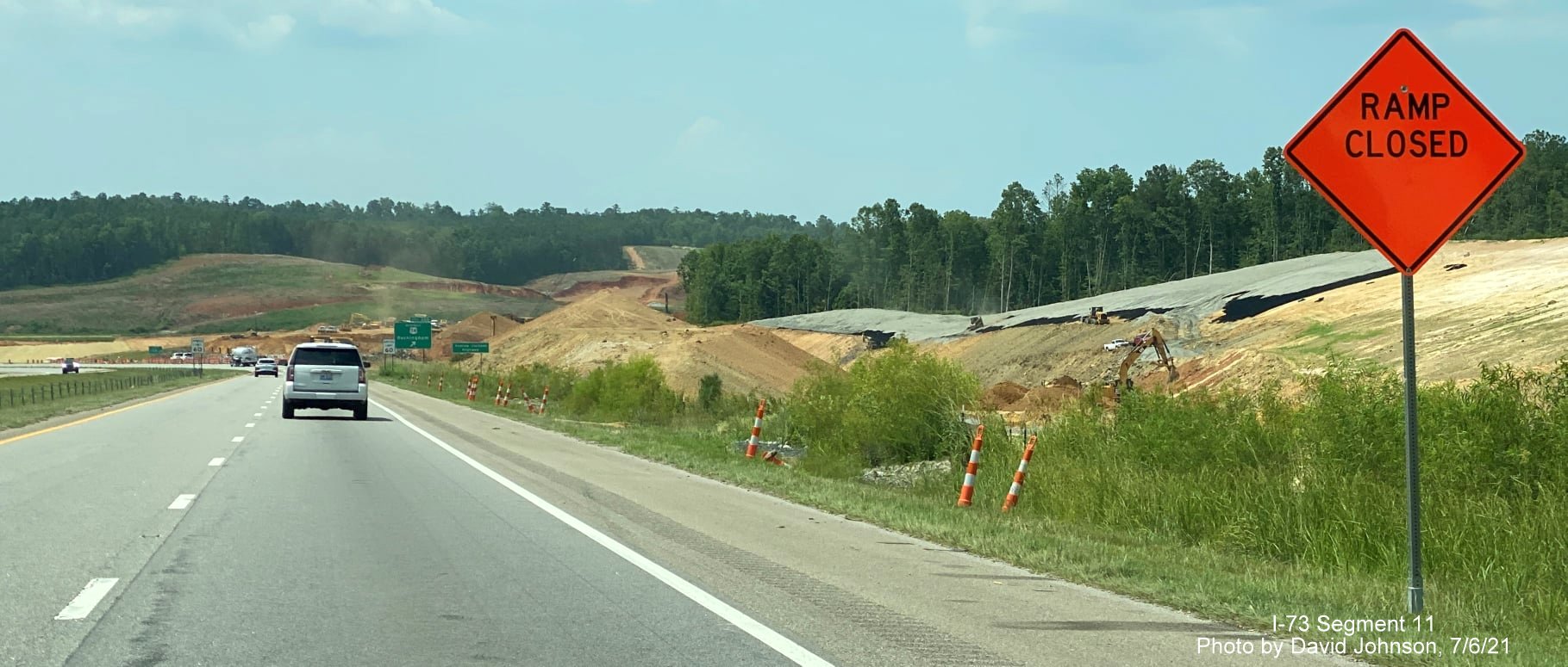Image of temporary ramp closed sign for closed Business US 74 interchange in I-73/I-74 Rockingham Bypass construction zone as seen from 
        US 74 West, by David Johnson, July 2021