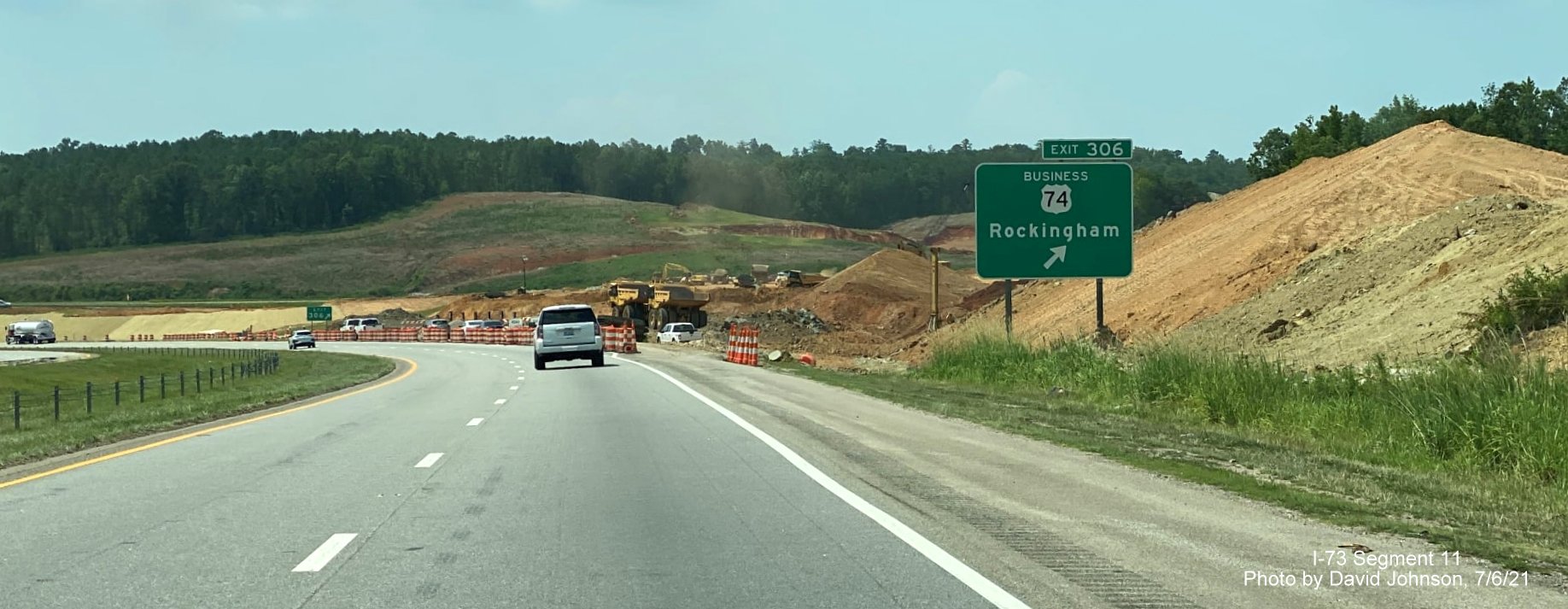 Image of exit sign for closed Business US 74 interchange in I-73/I-74 Rockingham Bypass construction zone as seen from 
        US 74 West, by David Johnson, July 2021