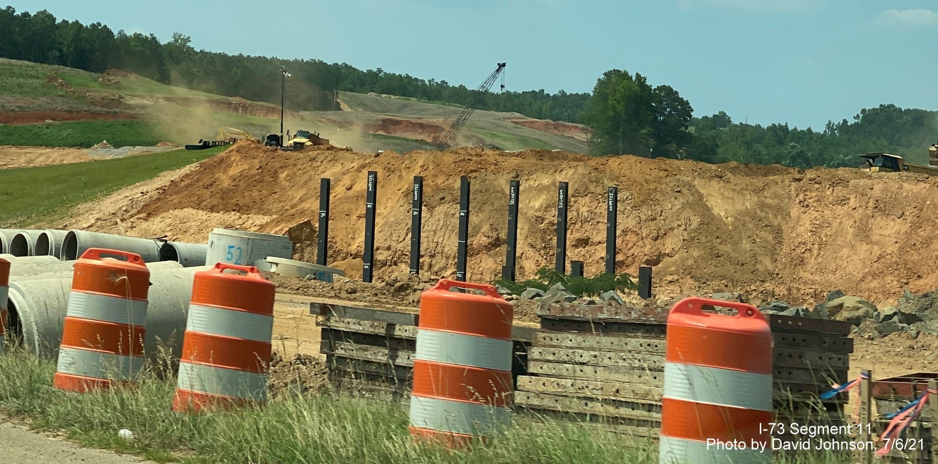 Image of supports in place for future ramp bridge of I-73/I-74 Rockingham Bypass interchange in construction zone as seen from 
        US 74 West, by David Johnson, July 2021