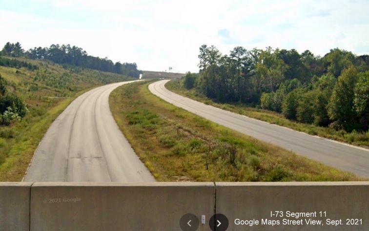Image of view looking south from Harrington Road bridge over future I-73/I-74 Rockingham 
        Bypass, Google Maps Street View image, September 2021