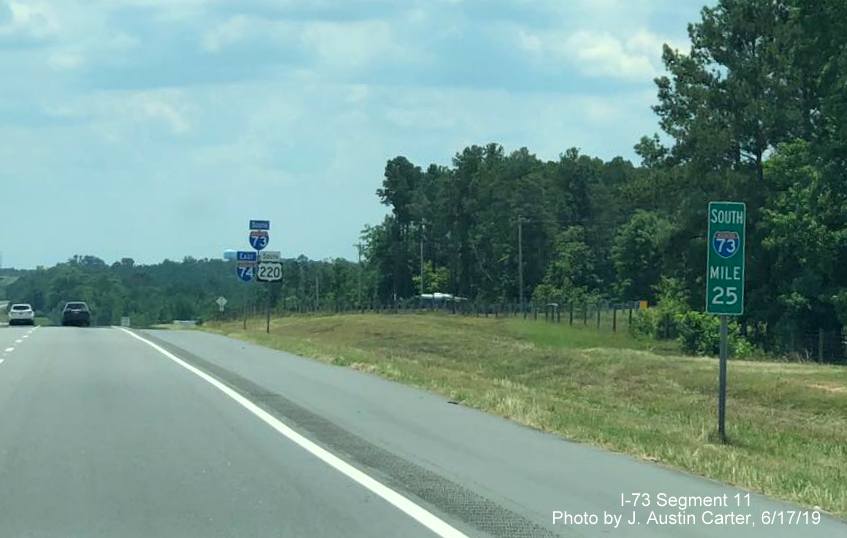 Image of South I-73 mile marker and South I-73/US 220, East I-74 reassurance markers south of Ellerbe in June 2019, by J. Austin Carter