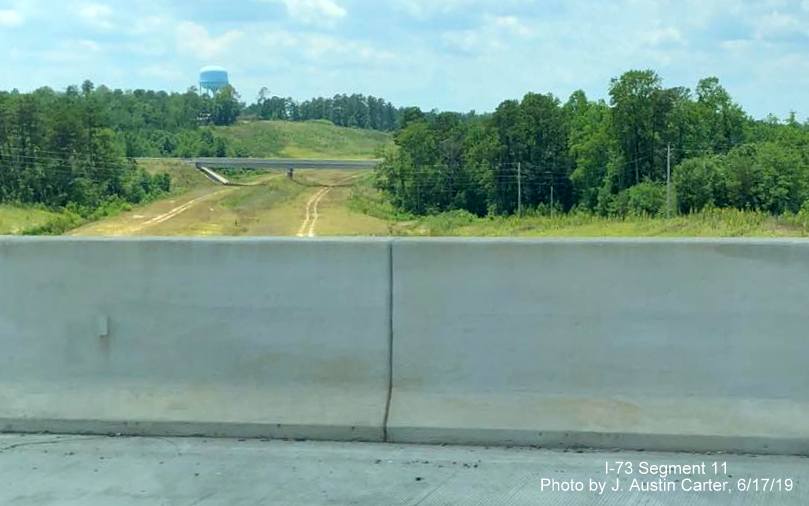 Image of graded future I-73/I-74 Rockingham Bypass freeway as seen from ramp to US 220 South in Richmond County, by J. Austin Carter