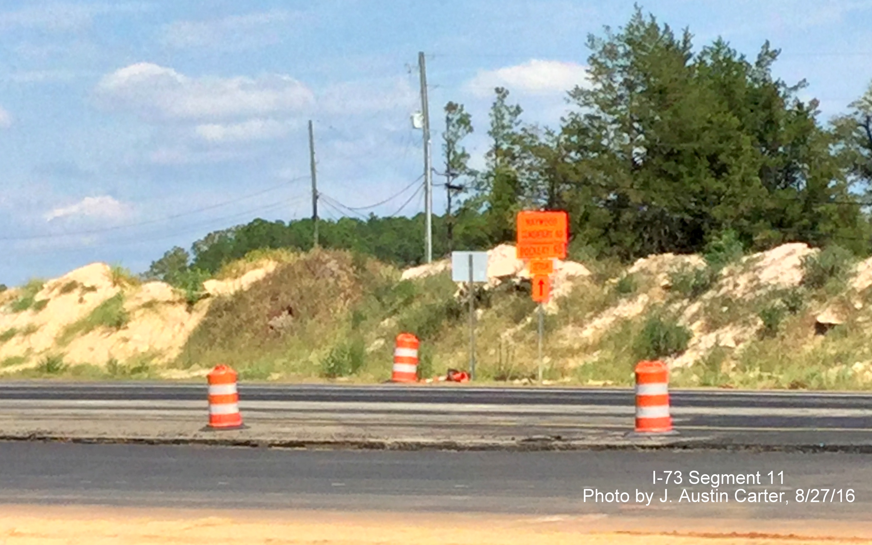 image of closeup of detour sign for Haywood Cemetery Road on US 220 North in future interchange construction area, by J. Austin Carter