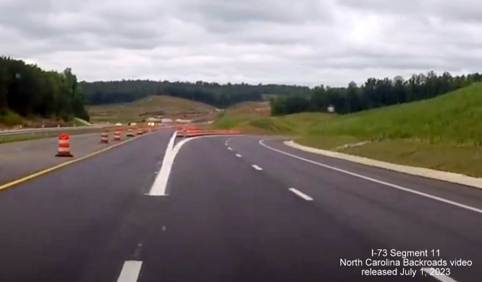Image of future US 74 West ramp now serving as through lanes at future interchange with I-73/I-74 
       Rockingham Bypass, video from North Carolina Backroads, July 2023