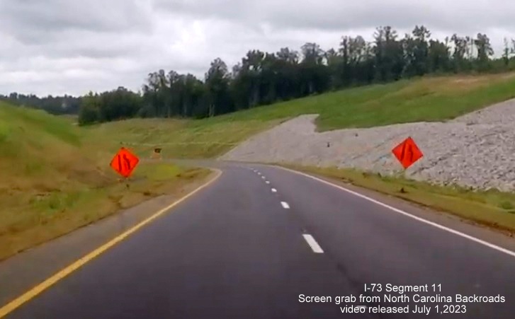 Image of US 74 West traffic now using future ramps from I-73 North/I-74 West at construction zone for 
       Rockingham Bypass, video from North Carolina Backroads, July 2023