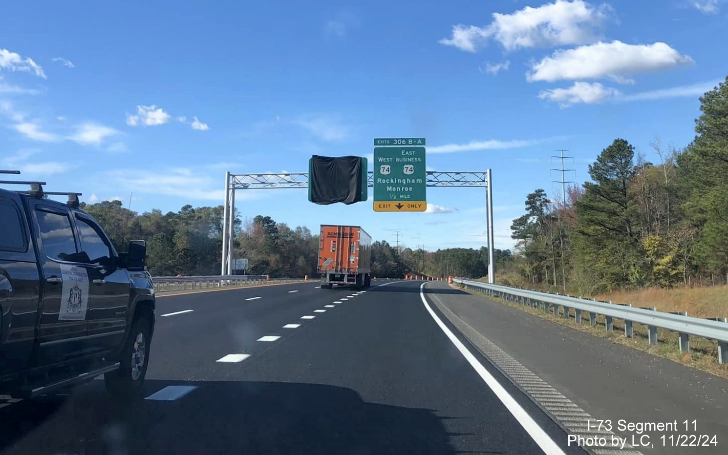 Image of recently placed overhead signage approaching future exit ramp from I-73 North/I-74 West
        Rockingham Bypass on US 74 West, by LC, November 2024