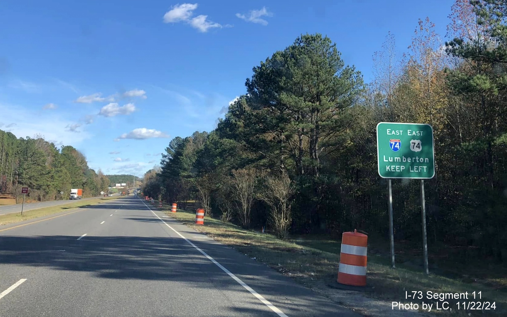 Image of recently placed guide sign for I-74/US 74 West on US 74 East, by LC, November 
        2024