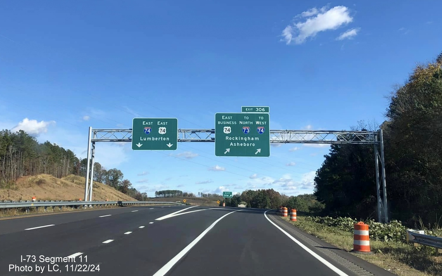 Image of recently placed overhead signage at exit ramp for Business 74 and future I-73 North/
        I-74 West Rockingham Bypass on US 74 East, by LC, November 2024