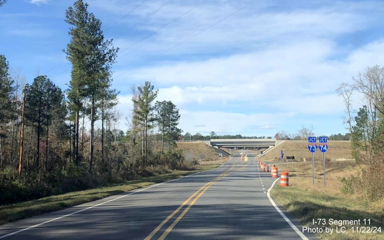 Image of recently placed Jct I-73/I-74 signs heading west on Cartledge Creek Road, by LC, November 
        2024