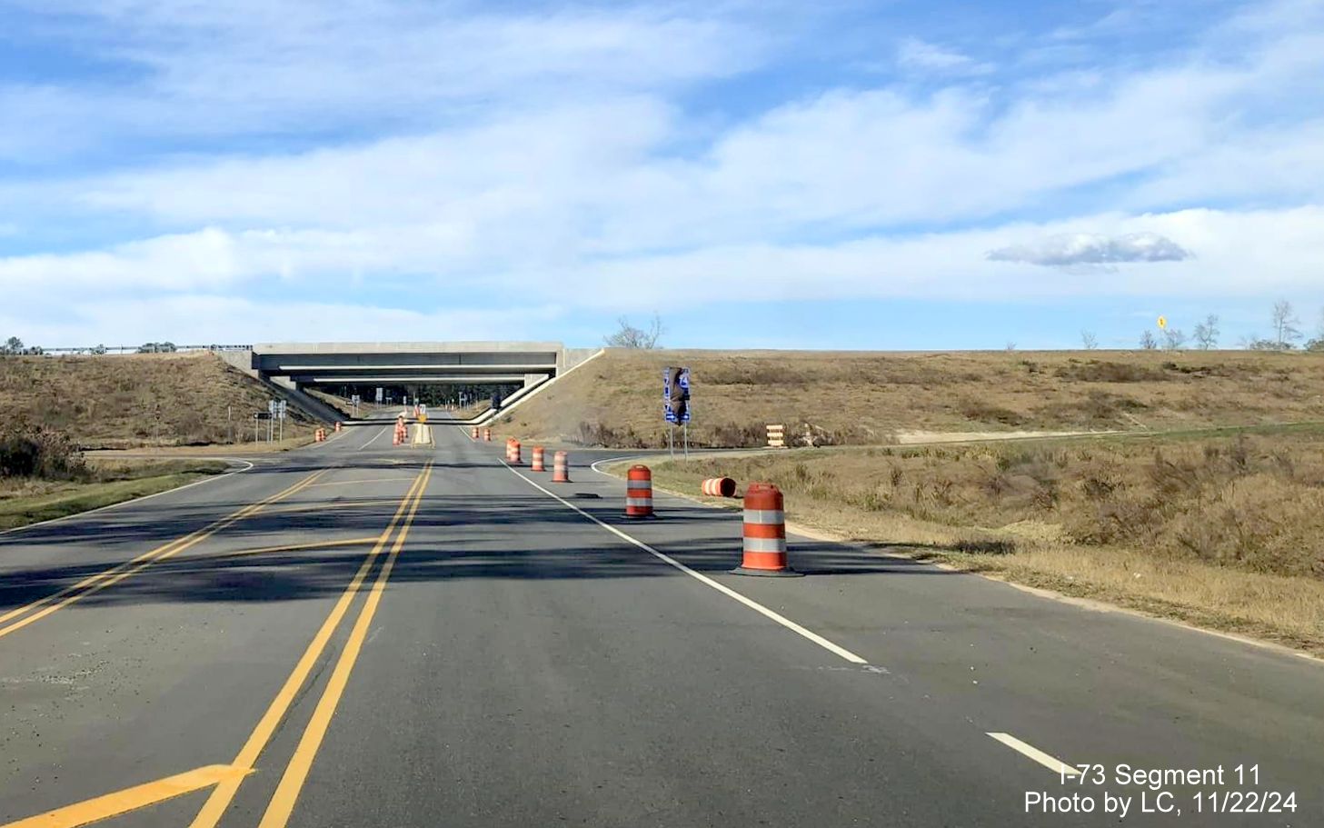 Image of recently covered over I-73 North/I-74 West trailblazers on Cartledge Creek Road, by 
        LC, November 2024