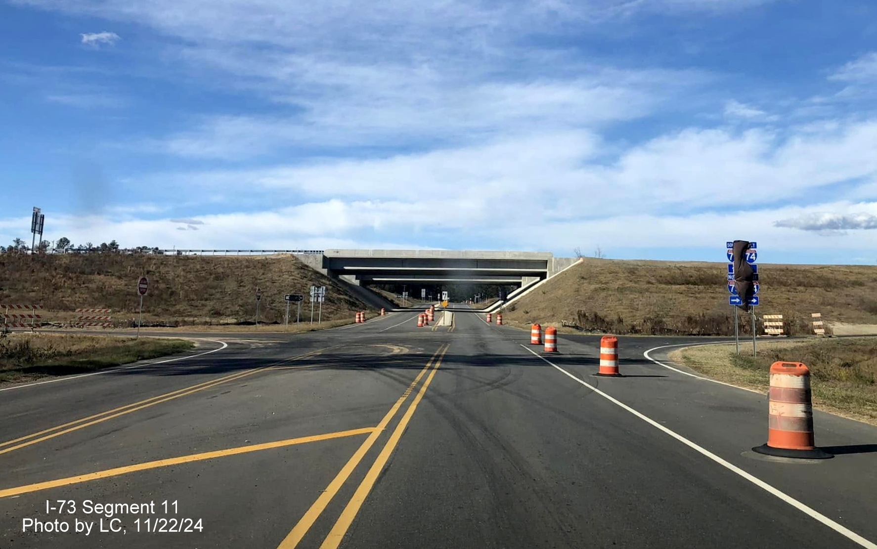 Image of recently covered over I-73 North/I-74 West trailblazers on Cartledge Creek Road, by 
        LC, November 2024