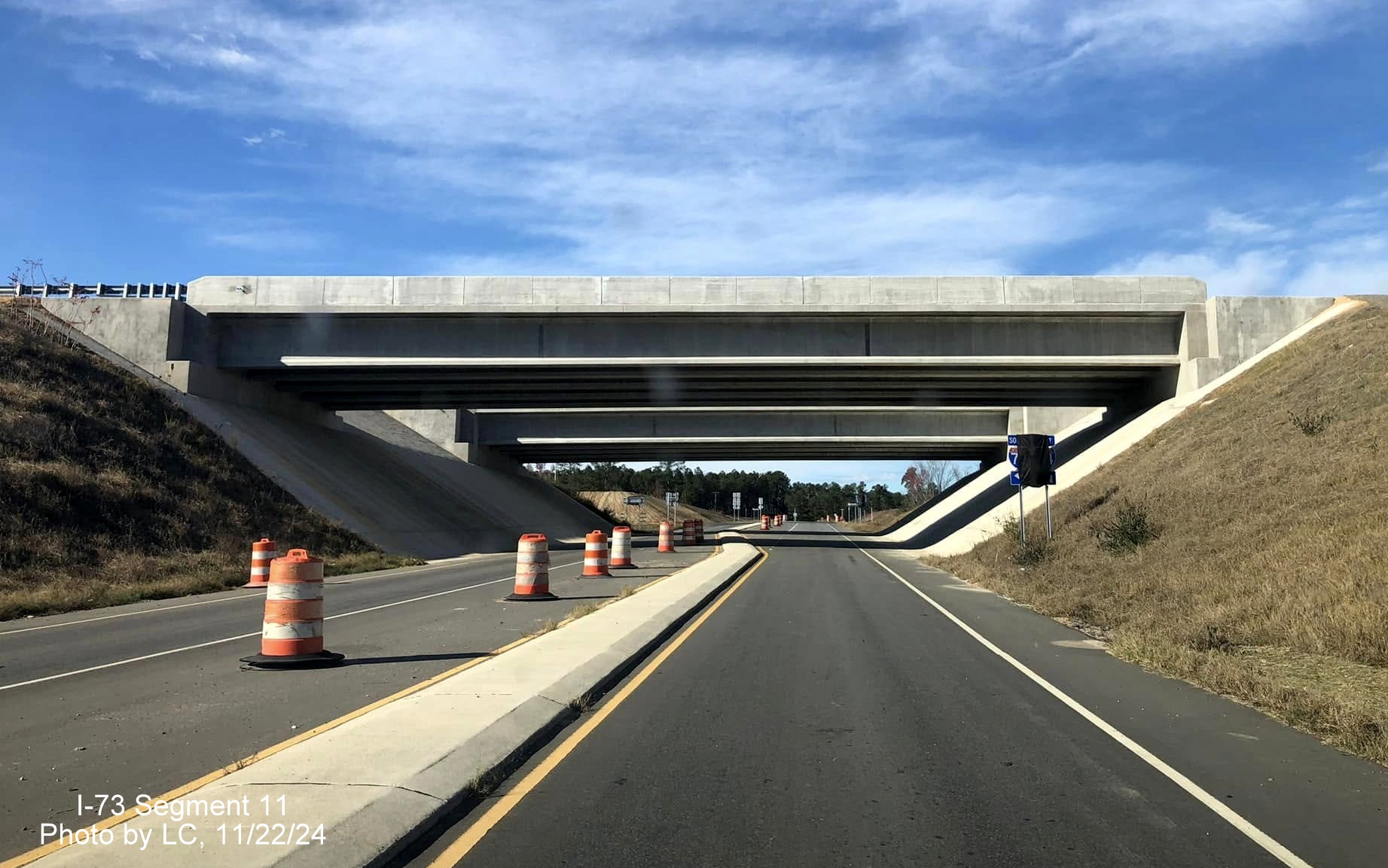 Image of approaching the I-73/I-74 bridges over Cartledge Creek Road heading west, by 
        LC, November 2024