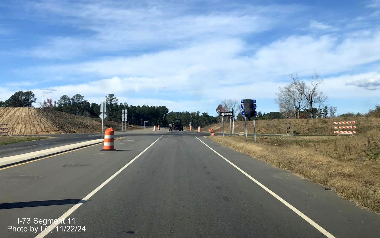 Image of recently covered over I-73 South/I-74 East trailblazers on Cartledge Creek Road, by 
        LC, November 2024