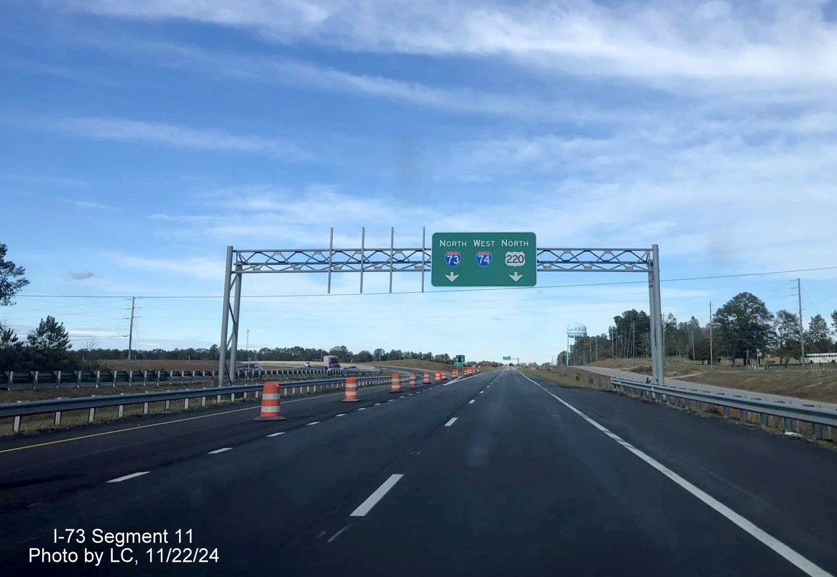 Image of overhead sigs at the I-73 South/I-74 West exit on US 220 North at end of the
        Rockingham Bypass, by LC, November 2024