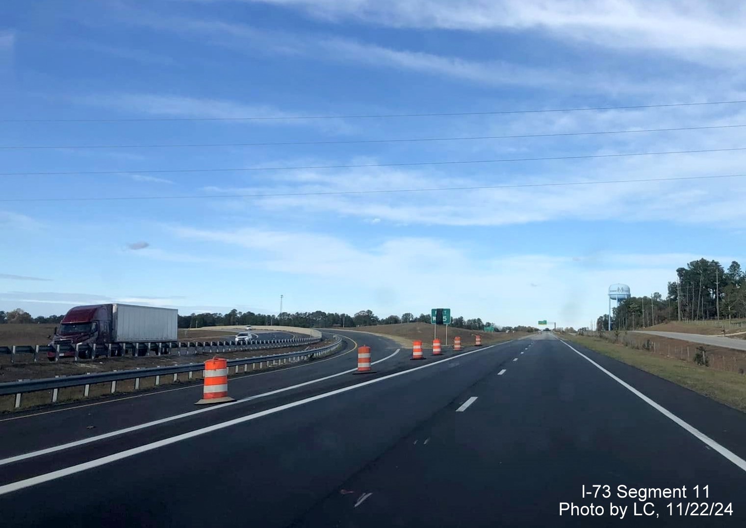 Image of covered up gore sign for I-73 South/I-74 West exit on US 220 North at end of the
        Rockingham Bypass, by LC, November 2024