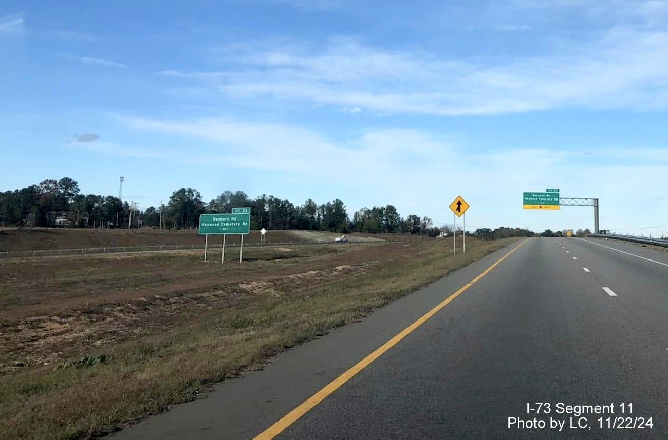 Image of new 1 mile advance sign for Dockery Road/Haywood Cemetery Road on I-73 North/I-74 East
        seen from US 220 North at end of the Rockingham Bypass, by LC, November 2024